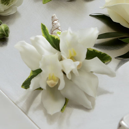 White Mini Cymbidium Boutonniere –  Flowers By Design, Midland TX